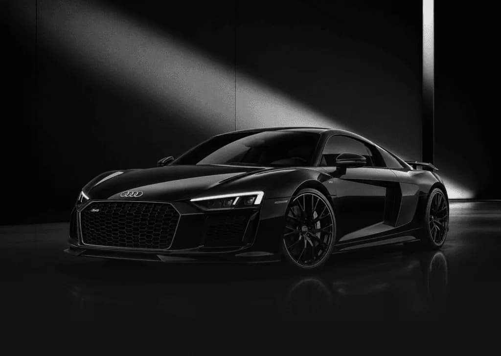 Luxury sports car in a dark automotive studio
